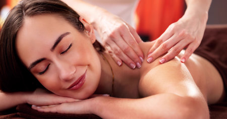 Skilled Physiotherapist Administers Manual Shoulder Massage for Sports Injury Treatment.の写真素材