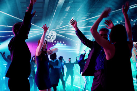 Young African American Man In A Trendy Night Club Party. Happy Diverse Group Of Friends Dancing At A Nightclubの写真素材