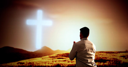 Inspirational Concert: Young Hispanic Man Raises Hands In Worshipの写真素材