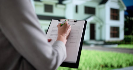 The Professional Real Estate Agent Is Appraising A Property Now.の写真素材