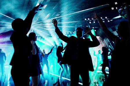 Vibrant Night Club Scene: Friends Dancing And Celebrating Togetherの写真素材