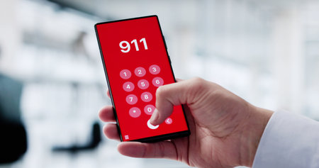 Hispanic Man Dialing 911 For Emergency Aid On His Smartphone.の写真素材
