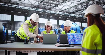 Skilled Technician And Young Engineer Monitor Automated Powerplant Operations Closely.の写真素材
