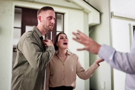 Frustrated Couple Argues Loudly In Front Of Worried Neighbors At Apartment