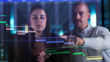 Young Male And Female Using Gantt Software For Project Controlの写真素材