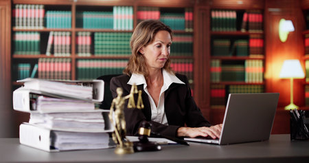 Stressed Female Lawyer Overwhelmed With Tax Paperwork At Wooden Desk.