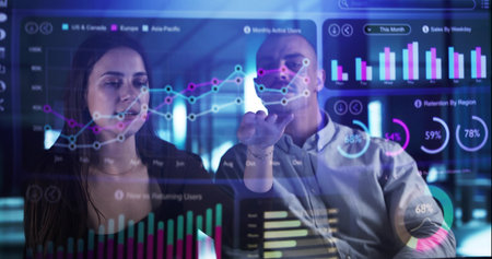 Man And Woman Analyzing Financial Data On Holographic Office Dashboard. Young Analyst And Advisor...