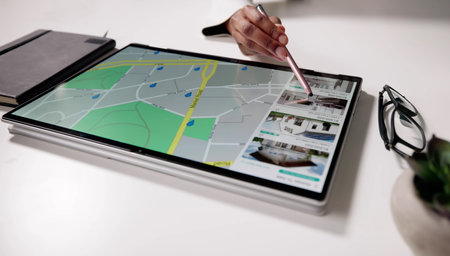 Young Woman Using Tablet To Search For Homes Online. Real Estate Locator Guiding African-American...