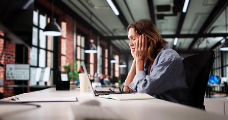 Stressed Accountant Woman In Busy Office With Headache And Ache.