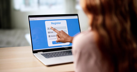 African American Woman Filling Out User Registration On Laptop Computer.