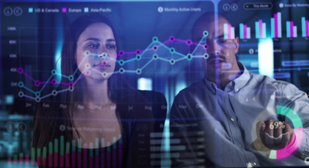 Man Analyzing Financial Data On Holographic Dashboard In Corporate Office.