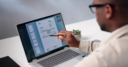 Busy Accountant Uses Invoice Software To Calculate Taxes For Clients.