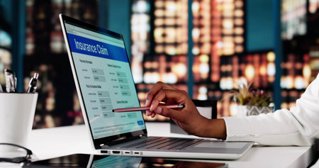 Woman Filing Online Insurance Application For Life Policy On Laptop.