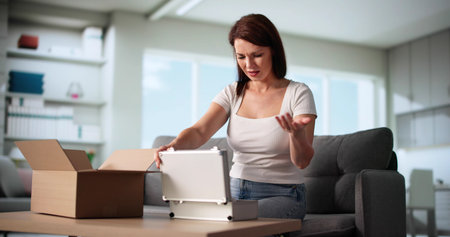 Home Office Disaster: Woman Unpacks Damaged Online Order Box