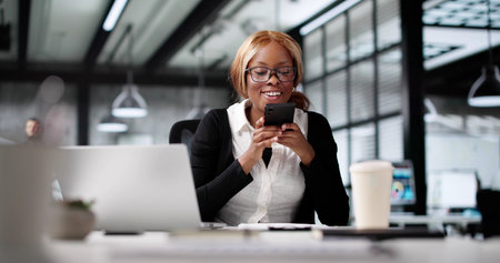 African Lady Using OCR Software To Take Mobile Photo Invoice.の写真素材