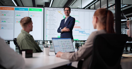 Agile Project Management Training Leads Diverse Group In Corporate Office.