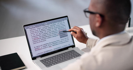 Document Proofreading: African American Man Editing Script Online Spelling Errors