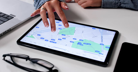 Tech-Savvy Real Estate Agent Analyzing Online Property Listings On Tablet