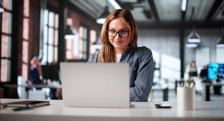 Female Business Analyst Conducting Online Meeting With Executives In Officeの写真素材