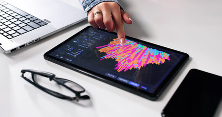 Female Analyst Uses Tablet For Business Data Analysis In Technology.の写真素材