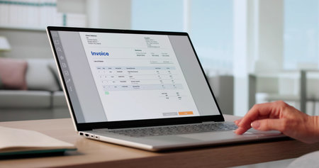 Focused Woman Managing Business Invoices With Advanced Software Technology Remotely.