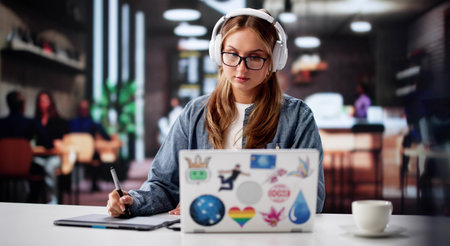Busy Female Student Designs Graphics Online With Laptop In Office.