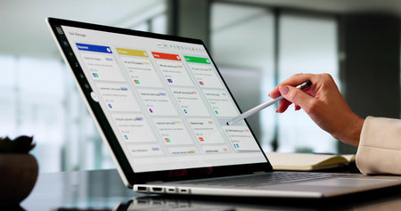 Executive Woman Utilizing Software For Project Management On Office Calendar