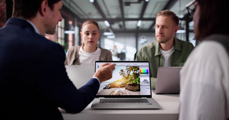 Multiracial Team Of Graphic Designers Collaborate On Colorful Web Designの写真素材