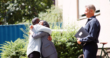 New Homeowners: Young Hispanic Couple Receives Keys From Real Estate Agent