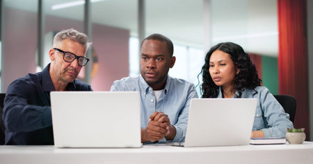 African And Hispanic Designers Working Together On Innovative Marketing Strategy.の写真素材