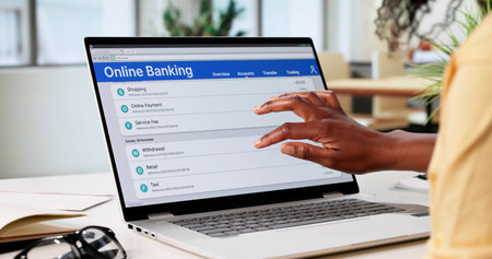 African American Woman Securely Managing Her Online Banking Accounts At Home.の写真素材