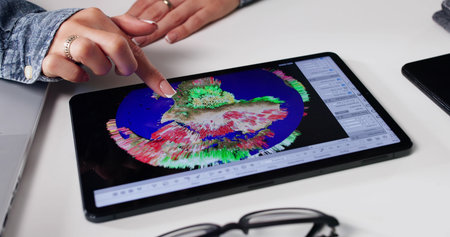 Female Scientist Tracking Hurricane Consequences On Tablet For Weather Forecast.