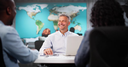 Smiling Couple Visits Travel Agency Office To Choose Vacation Package. Man And Woman Shake Hands