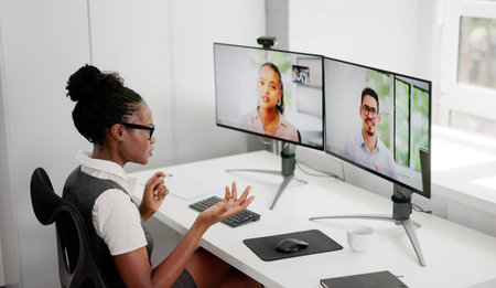 African American Woman Leading Virtual Conference With Multiple Participants Online.