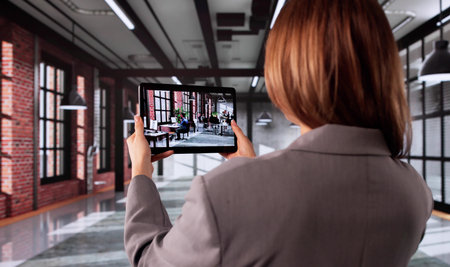 Woman Using AR Technology To Scan Room For Office Design, Real Estate Agent