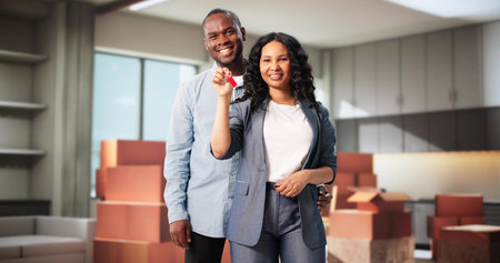 Happy Couple, New Homeowners With Keys, Looking At Their Home.の写真素材
