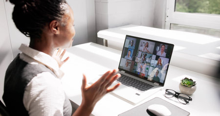 Successful Black Woman Leading Virtual Business Strategy Meetingの写真素材