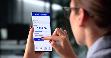 Secure Online Banking: Young Caucasian Woman Transfers Money With Fingerprint