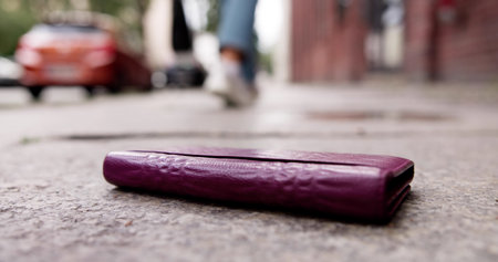 Mystery Of The Lost Wallet Dropped On Busy City Street. Young Woman, A Banker, Frantically Searchingの写真素材