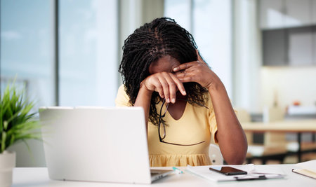 African American Woman Wearing Glasses Scratching Itchy Eye At Homeの写真素材