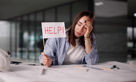 Frantic Architect Raises Help Flag Under Overload In Office Settingの写真素材