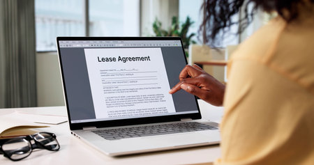Woman Signing Lease Agreement For Renting Real Estate Home Online.の写真素材