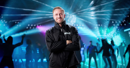 Smiling Security Guard Keeping Watch At The Music Festival Tonight.の写真素材