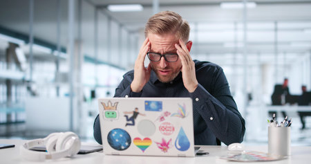 Emotionally Stressed Student Falls Victim To Business Laptop Ransomware Attack.の写真素材