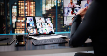 Late-night Virtual Conference: Female Executive Using Laptop For Online Meeting.