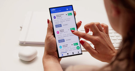 Searching For Employment Opportunities On Mobile App During Job Interview. Exploring Recruitment...