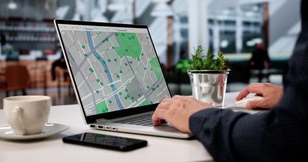 Potential Home Buyer: Young Man Scouring Real Estate Portal For Apartment