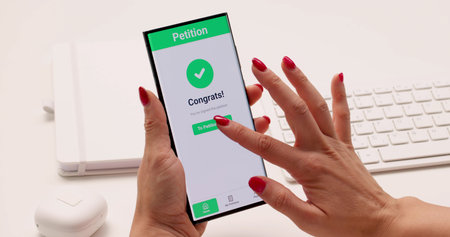 Digital Signature: Young Woman Filling Out Online Petition On Smartphone