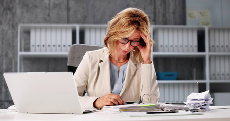 Exhausted Businesswoman: Overwhelmed With Numbers, Frustrated By Budget Planning