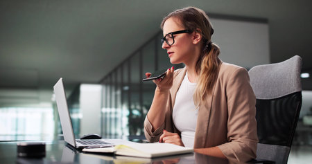 Friendly Woman Assisting Client Through Phone Communication With Her Computer.